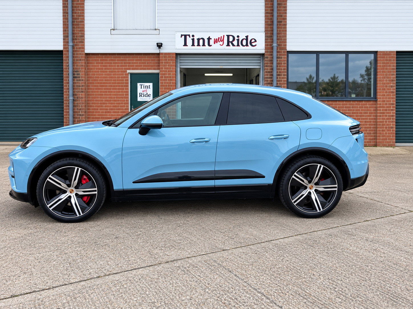 Porsche Macan prepared for a main dealer handover outside the Tint My Ride unit